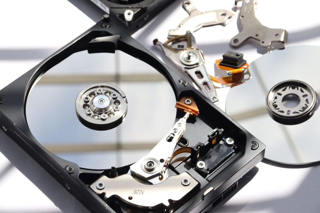 pexels photo 6310044 Detailed view of disassembled HDD showing intricate internal components.